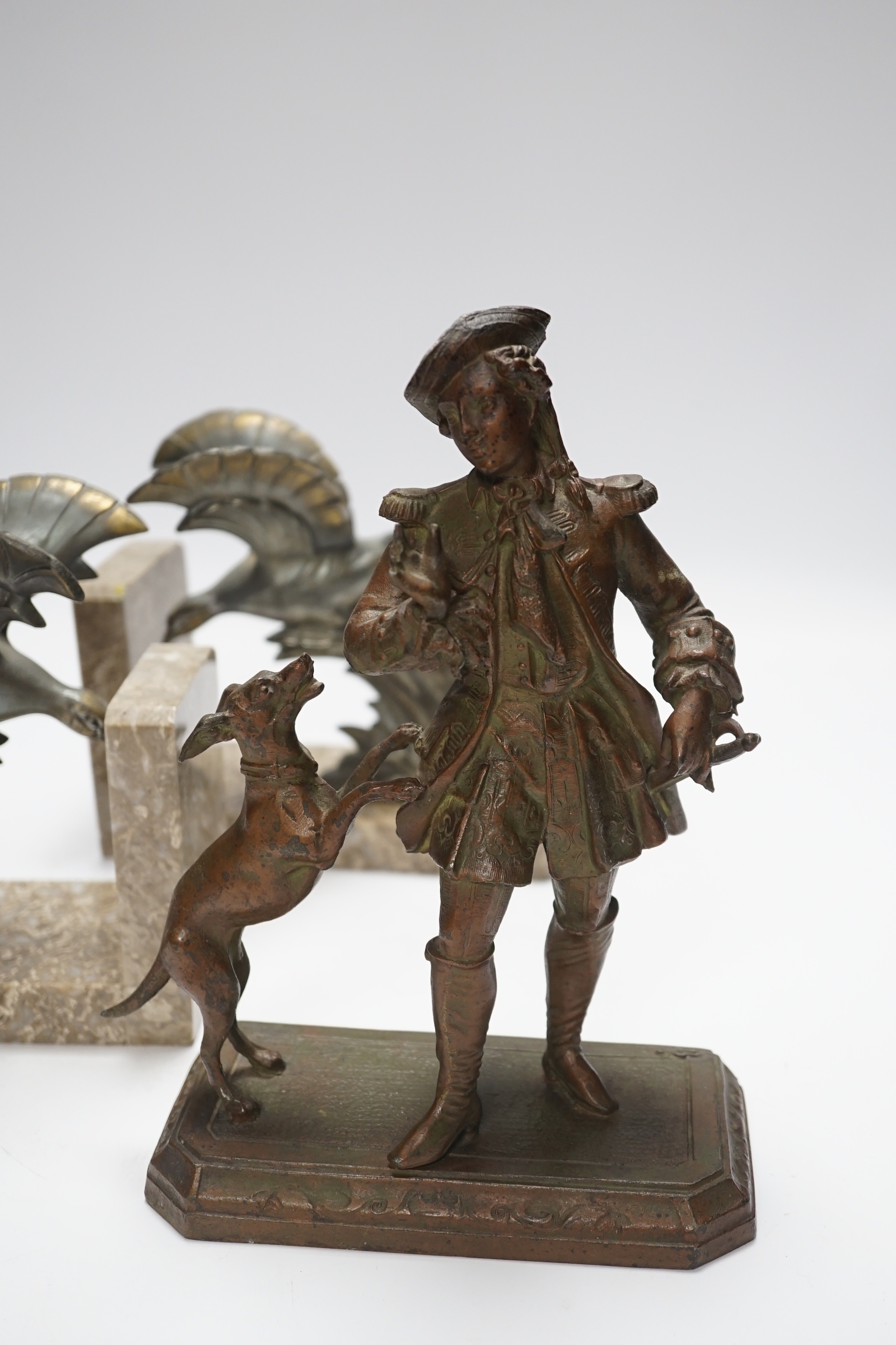A pair of spelter eagle bookends and a figure with dog, figure 23cm high